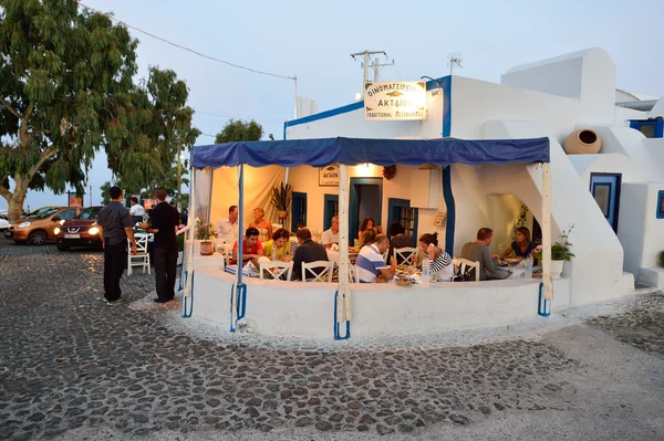 Open air restaurant on Santorini island — стокове фото