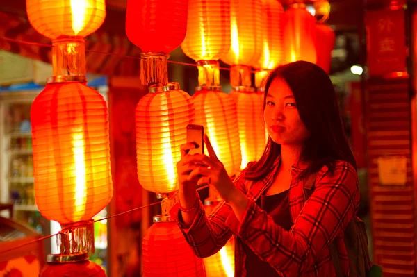 Chinese teenager with cell phone — Stock Photo, Image