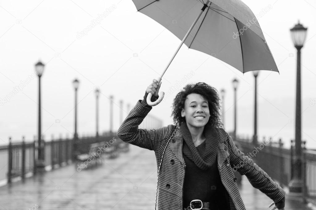 african american woman walking on the pier