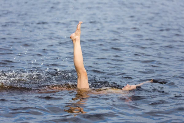 Woman in blue water lake — Stock Photo, Image