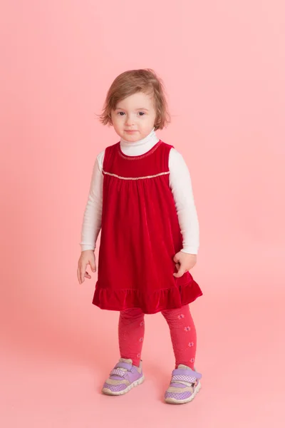 Little girl in a red dress — Stock Photo, Image