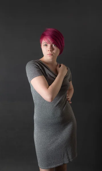 Girl in a gray dress — Stock Photo, Image