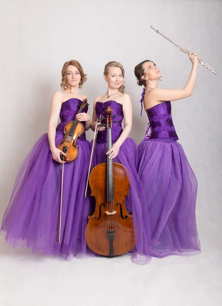 Trio med instrument — Stockfoto