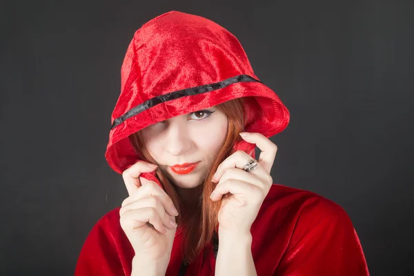 Girl in a red hood — Stock Photo, Image