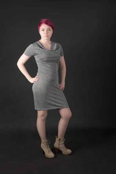 Girl in a gray dress — Stock Photo, Image