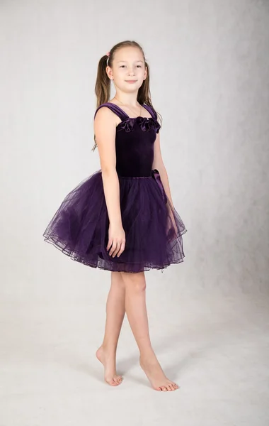 Girl in a purple dress — Stock Photo, Image