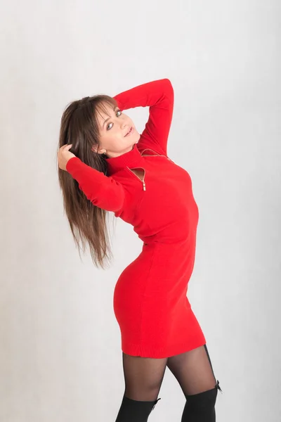 Slim girl in a red dress — Stock Photo, Image