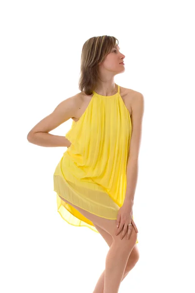 Sensual girl in a yellow dress — Stock Photo, Image