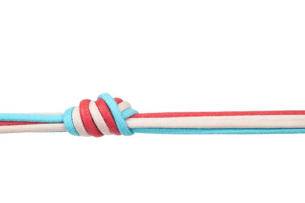 Rep eller skosnören bundna i en knut på en vit bakgrund — Stockfoto