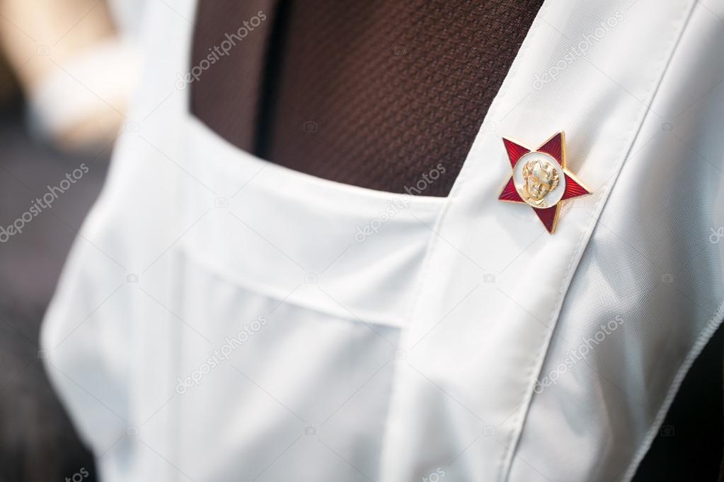 Octobrist Star on the Soviet school uniform