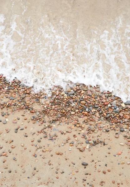 Sea wave over the pebbles on the beach, abstract natural backgro — Stock Photo, Image