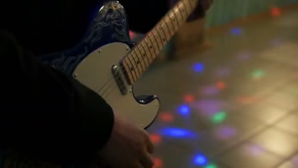 Young man playing on electric guitar close up — Stock Video