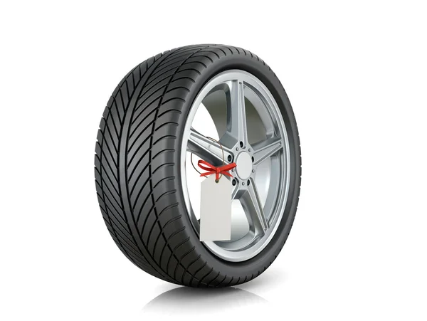 Automotive wiel met een-tag op een witte achtergrond. — Stockfoto