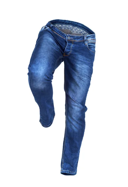Spouštění prázdné modré džíny izolovaných na bílém pozadí — Stock fotografie