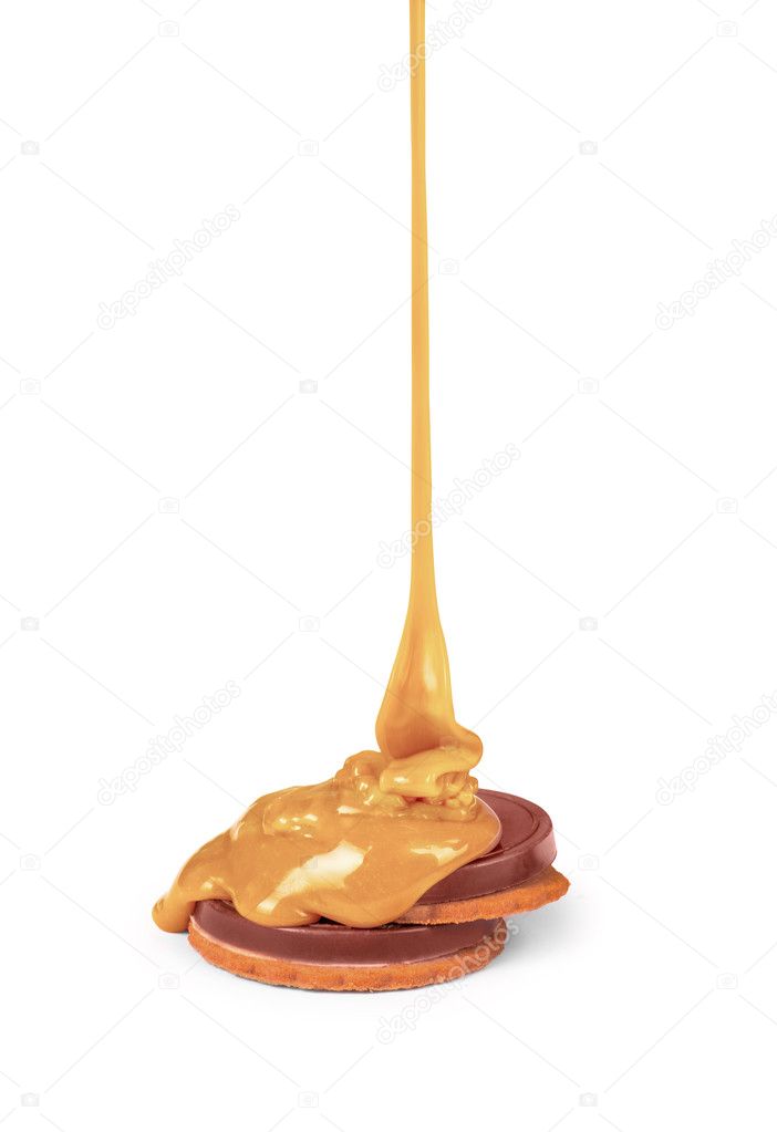 sweet caramel sauce is poured on a chocolate bar