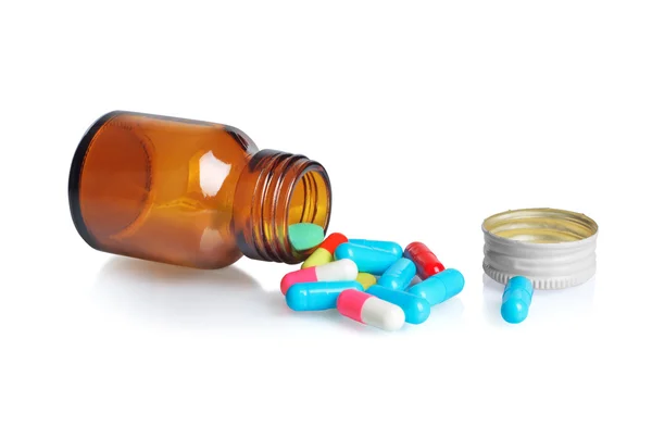 Pills pouring out of the brown bottle — Stock Photo, Image