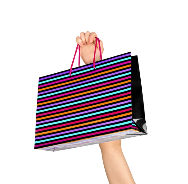 Female hand holding colorful shopping bags isolated on white bac — Stock Photo, Image