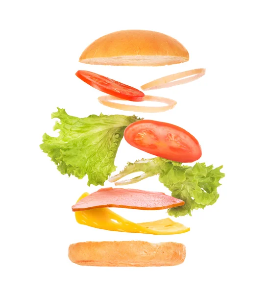 Νόστιμα burger με ιπτάμενα συστατικά σε άσπρο φόντο — Φωτογραφία Αρχείου