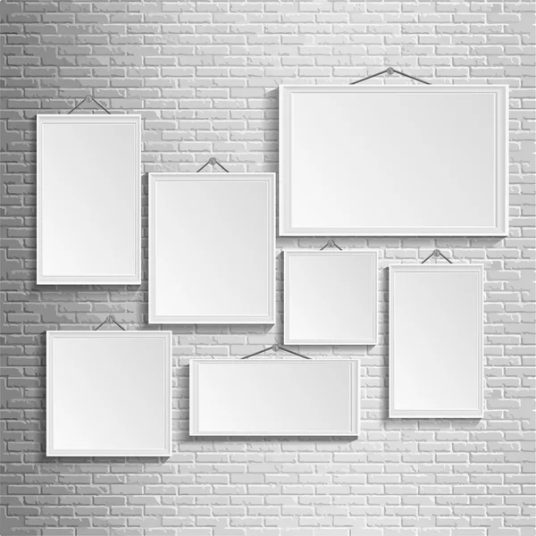 Blank picture frame template set isolated on wall — Stock Vector