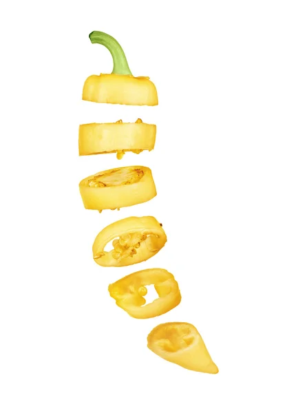 Sliced in pieces yellow pepper isolated over white background — Stock Photo, Image