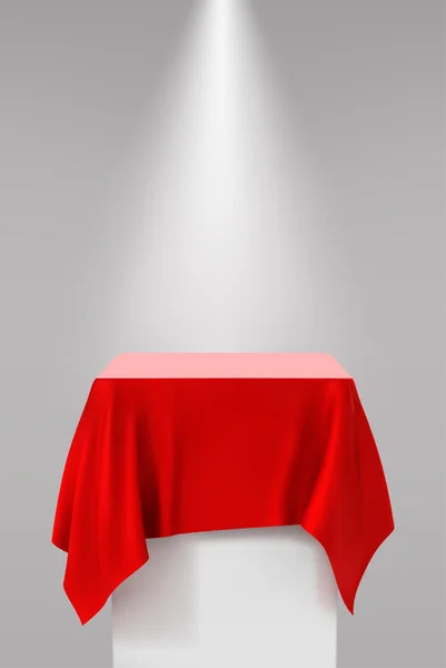 Pedestal de apresentação coberto com um pano de seda vermelho na frente de — Vetor de Stock