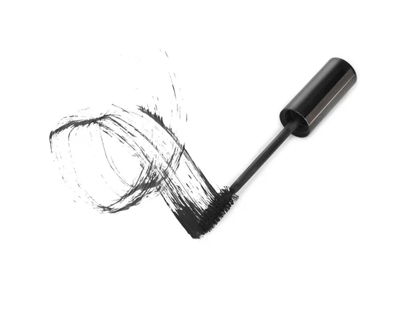 Makeup mascara tube, brush and stain isolated over white — Stock Photo, Image