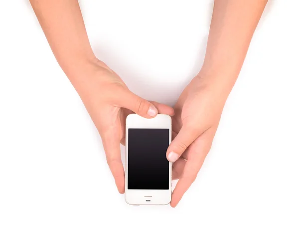 Телефон в женских руках на белом — стоковое фото