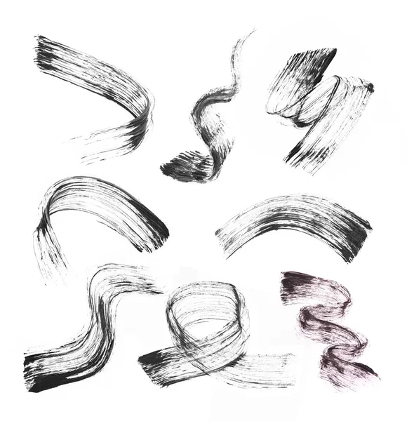 Sammlung von Schlaganfällen (Muster) schwarzer Mascara, isoliert auf weißem Grund — Stockfoto