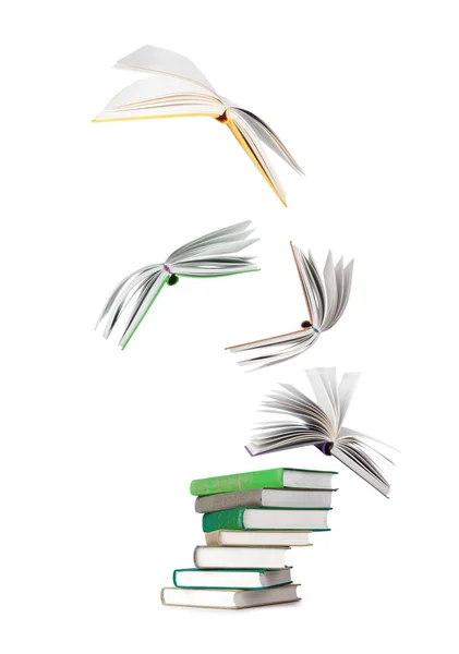 Stack of books and flying books isolated on white — Stock Photo, Image