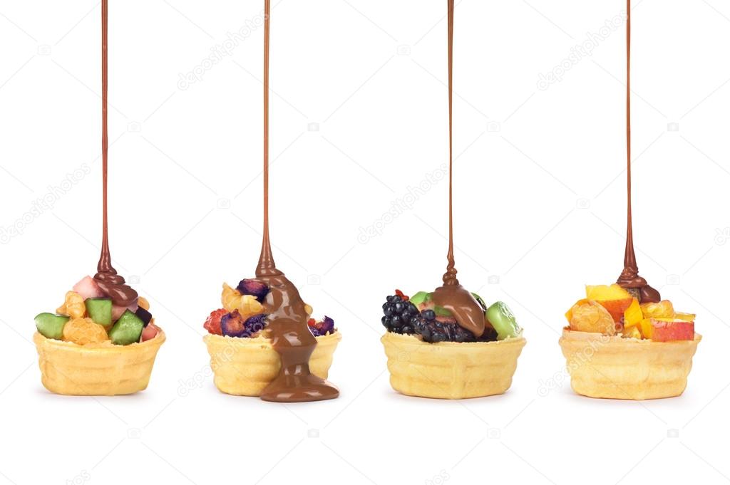 Chocolate pouring on fruit in waffle cup