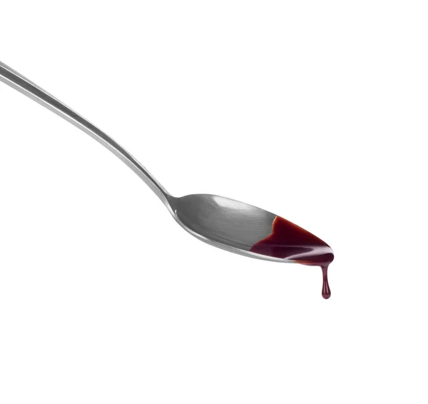Melted chocolate flowing on a spoon — Stock Photo, Image