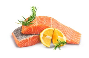 Fillet of red fish with lemon and rosemary on a white plate