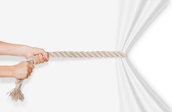 Hands pulling rope on a white background — Stock Photo, Image