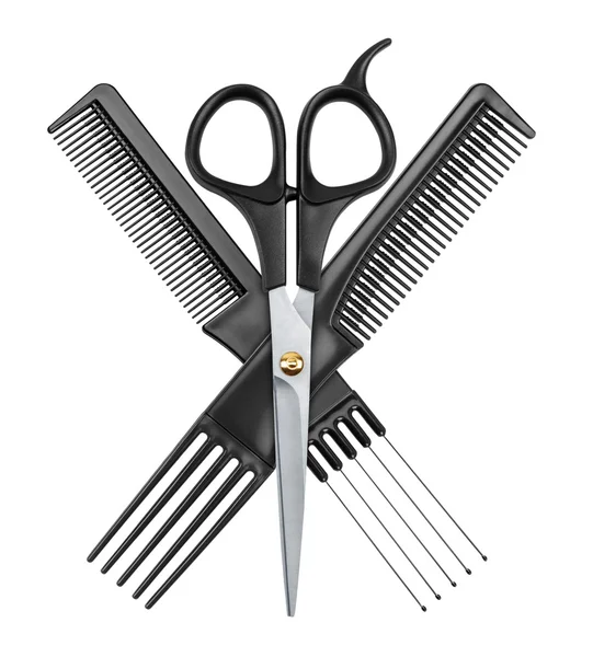 Профессиональные парикмахерские ножницы и две расчески — стоковое фото