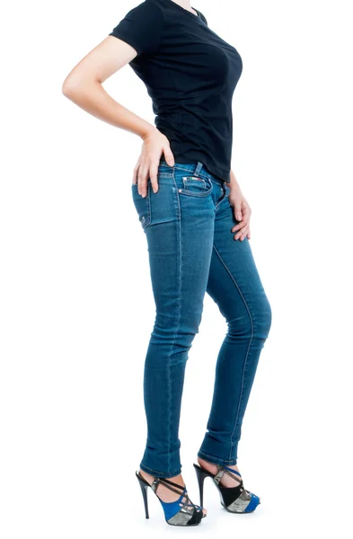 Ragazza in una t-shirt nera e jeans su sfondo isolato — Foto Stock