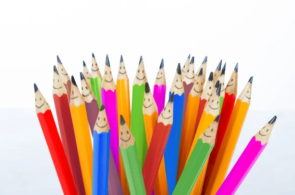 Colorful pencils as smiling faces people isolated. Social networking communication concept. — Stock Photo, Image