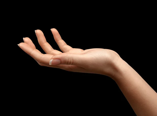 Female hand with open palm over black background — Stock Photo, Image