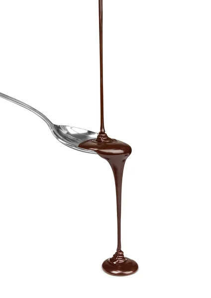 Chocolate vertido en una cuchara sobre fondo blanco — Foto de Stock