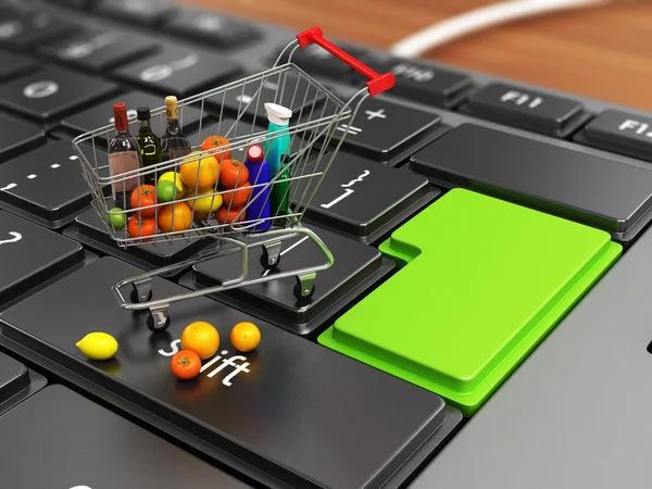 Shopping trolley over keyboard. E-market concept. — Stock Photo, Image