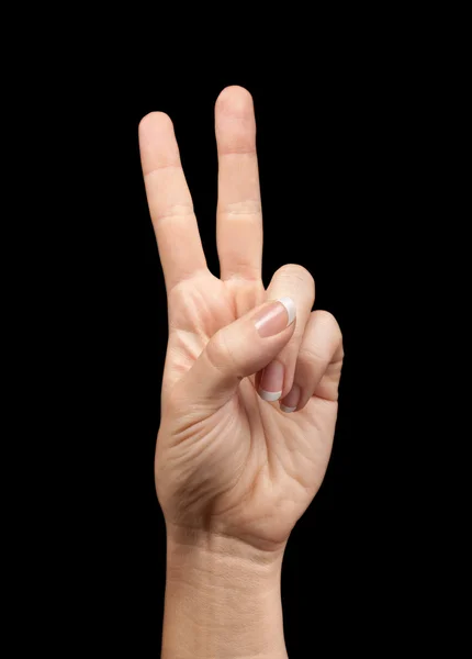 Female hand showing number two on black background — Stock Photo, Image