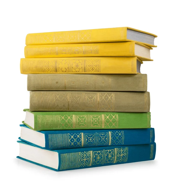 Stack of colorful vintage books on white isolation — Stock Photo, Image