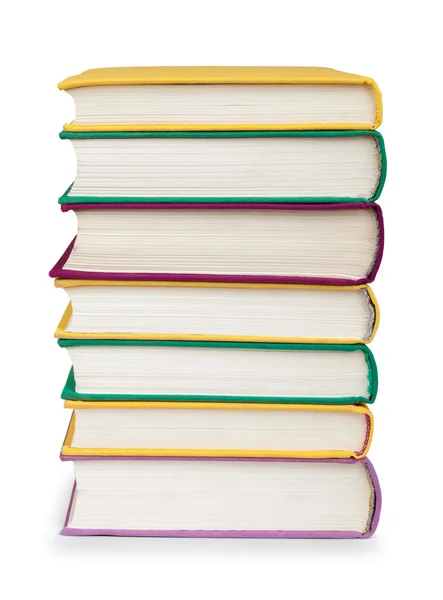 Stapel kleurrijke boeken in de textiel dekking op geïsoleerde Wit — Stockfoto