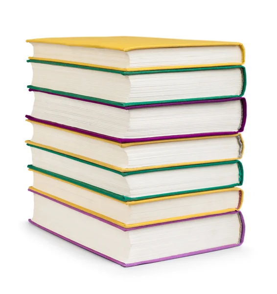 Stack of colorful books in the textile cover on isolated white — Stock Photo, Image