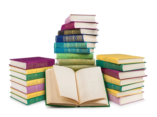 Empty open book and pile of colorful vintage books on an isolate — Stock Photo, Image