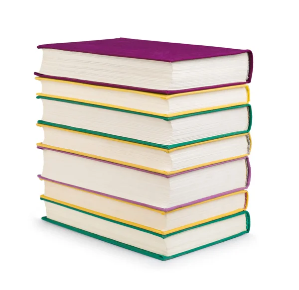 Stack of colorful books in the textile cover on isolated white — Stock Photo, Image