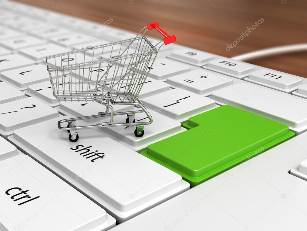 Shopping trolley over keyboard. E-market concept.