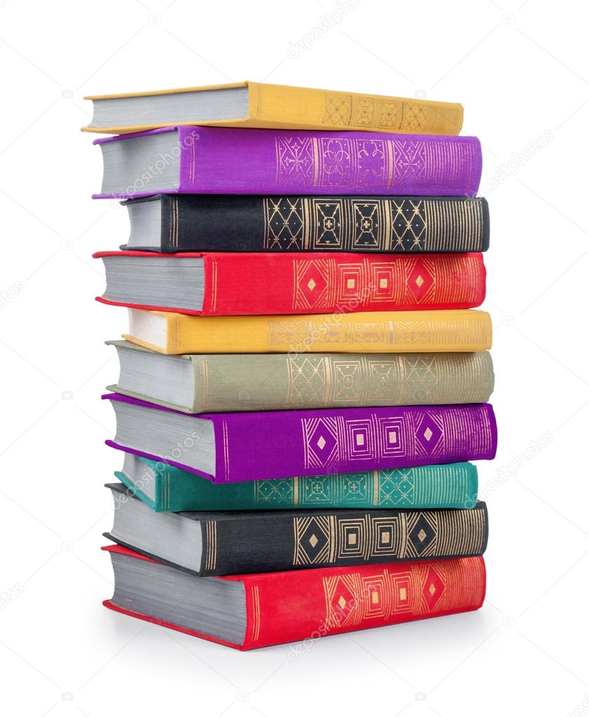 stack of colorful vintage books on an isolated white