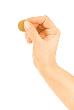 Sikke üzerinde beyaz bir arka plan ile el