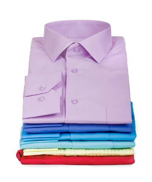 Stack of shirts isolated on a white background — Stock Photo, Image