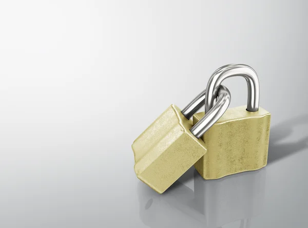 Two linked gold padlocks with reflections on a white background — Stock Photo, Image